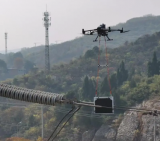 黄石供电公司为线路做“CT”检查，利用无人机吊载X光机器人带电探伤作业